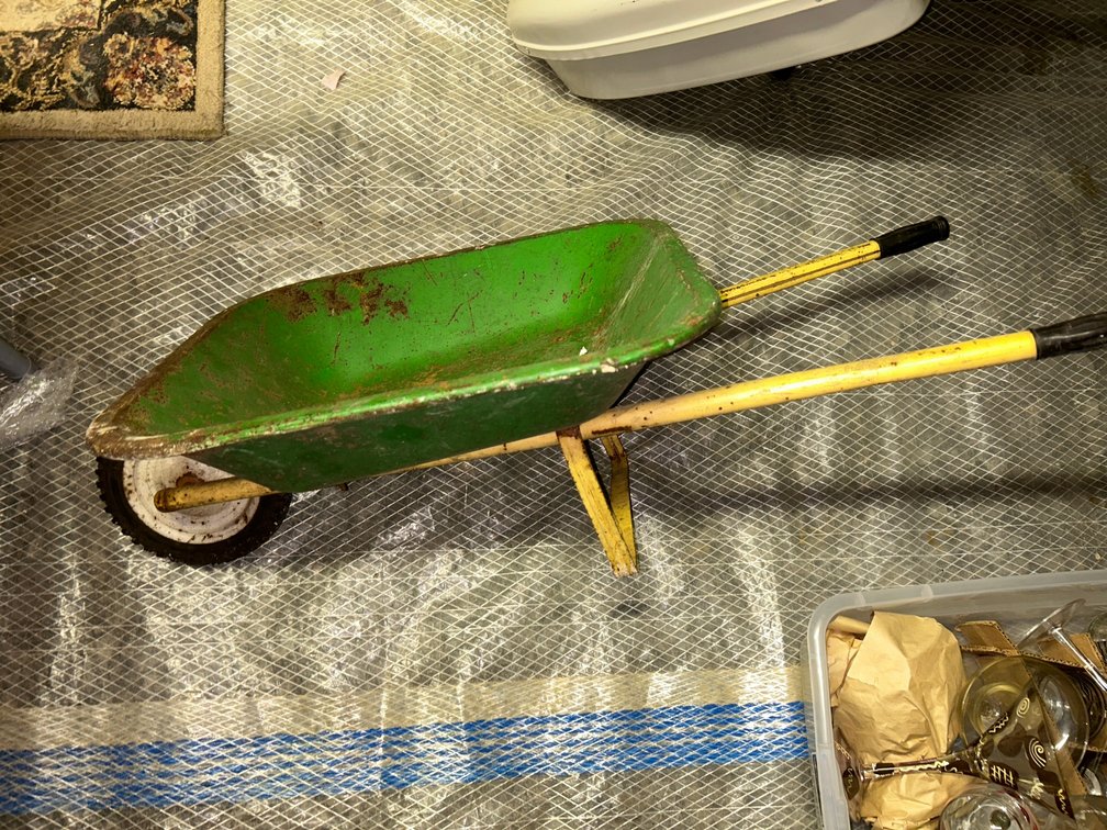 Child's vintage painted green wheelbarrow