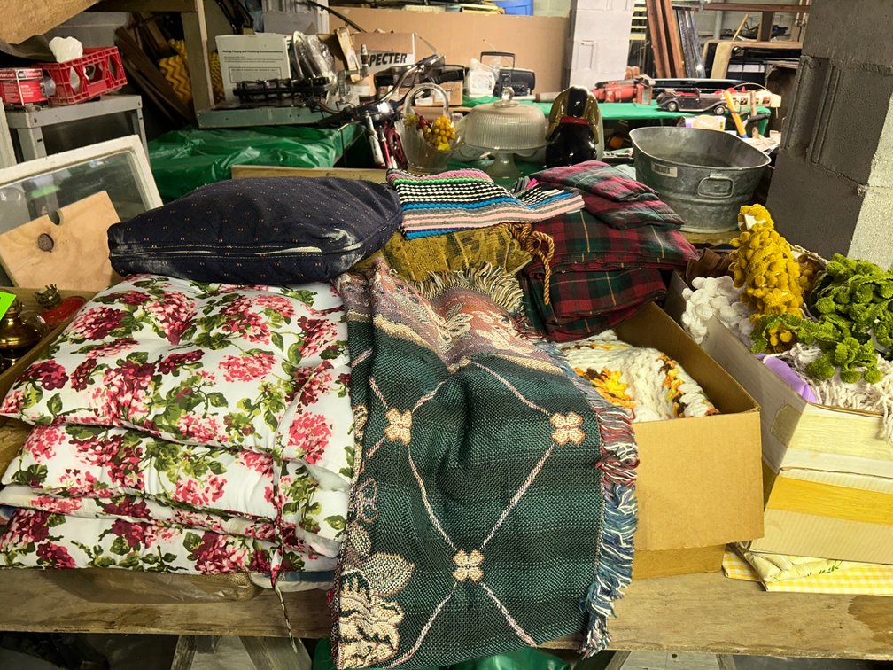 Decorative cushions, rugs, sheets, pillow cases, sewing trims and fabrics