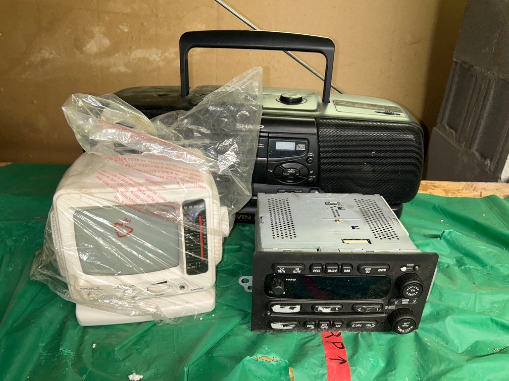 Lot with smaller TV, portable radio, car stereo