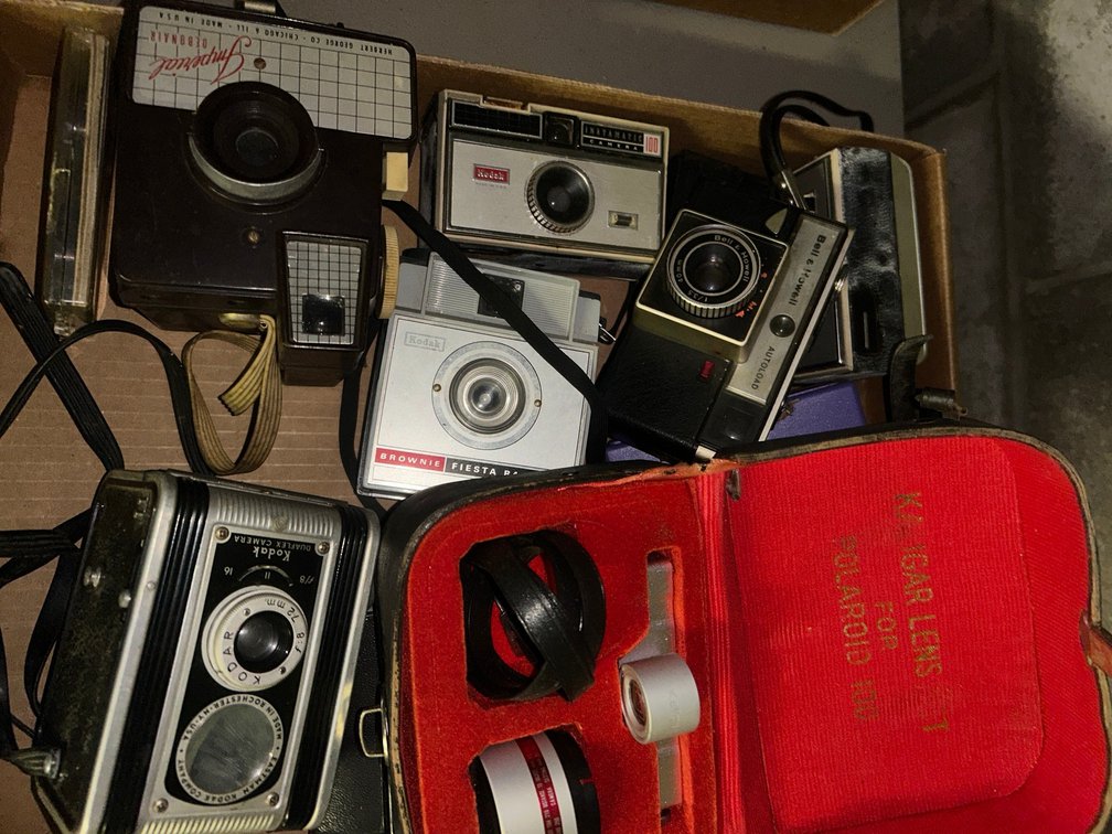 Imperial Debonair camera, Kodak Duraflex camera, camera lenses for Polaroid 100, Bell & Howell auto load camera