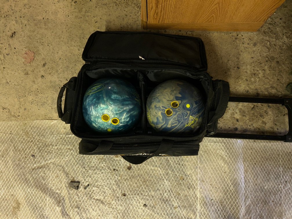 2 Bowling balls with storage case with wheels