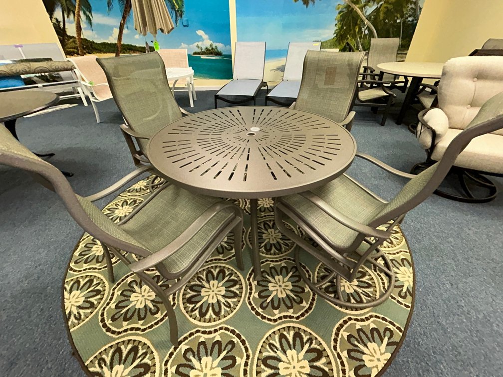 Tropitone Shoreline sling high back dining chairs and high back swivel rockers with La'Stratta 48" round table