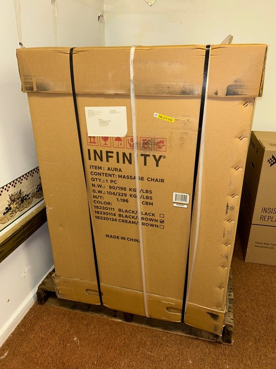Infiniti Aura massage chair, new in box on pallet