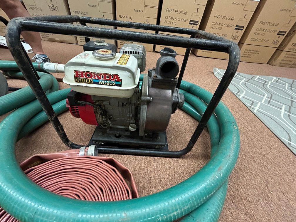 Honda WB20X gasoline powered trash pump with suction and discharge lines-used and does work