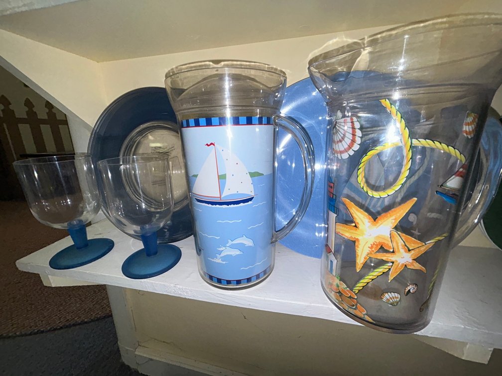 2 Pitchers, 2 blue goblets, 5 clear blue plates, 4 blue plates-**one pitcher has no lid**