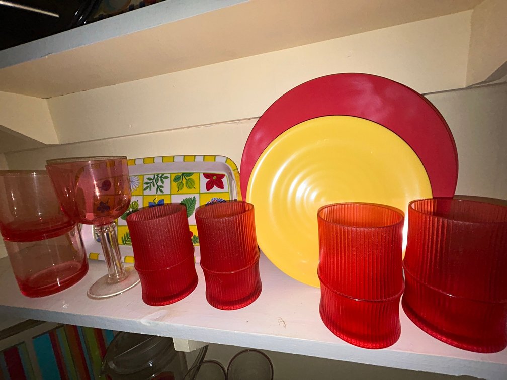 1 Small summertime tray, 7 cups, 1 goblet, 4 red plates, 3 small yellow plates