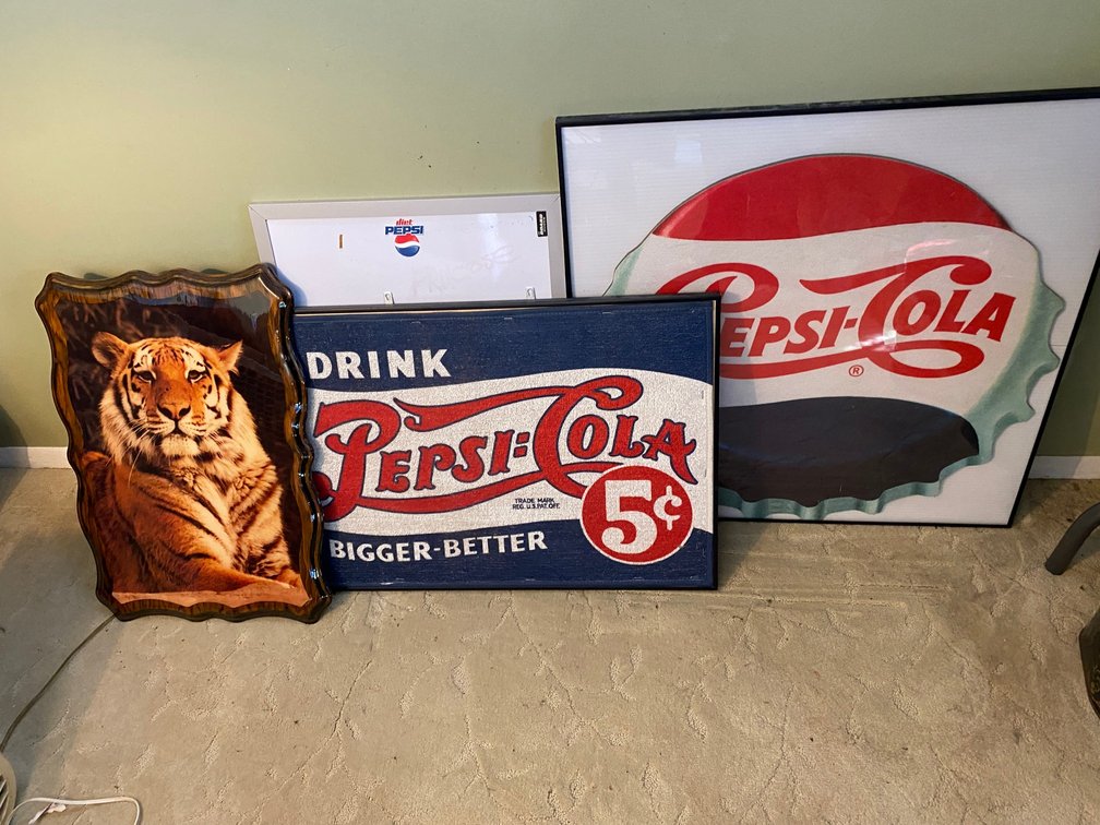 Pepsi-Cola framed floor mat, Pepsi-Cola framed bottle lid, corkboard, picture of a tiger
