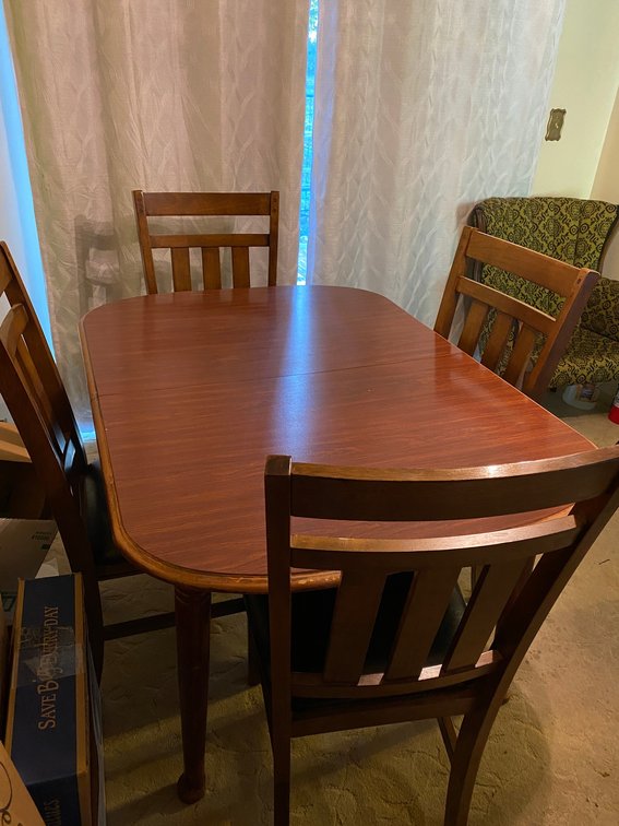 Dinette table-38" wide x 52" long, comes with 4 chairs**does have chips on edge and scratches**