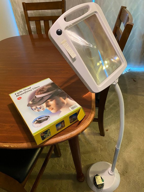 Magnifying lamp on floor stand base, magnifying head light assembly