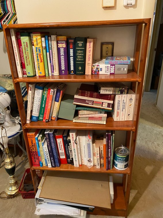 Wooden shelf with contents of books