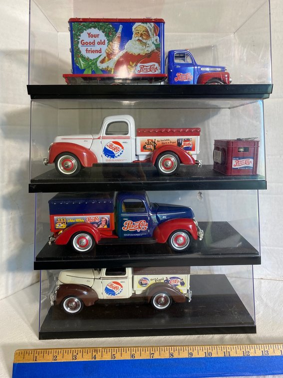 4 Die cast Pepsi-Cola trucks in plastic display cases