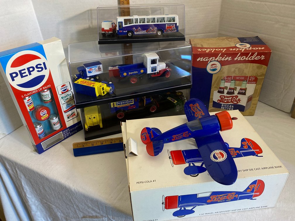 Pepsi-Cola collectible trucks, napkin holder, 5 flavor lip balm set, die cast airplane