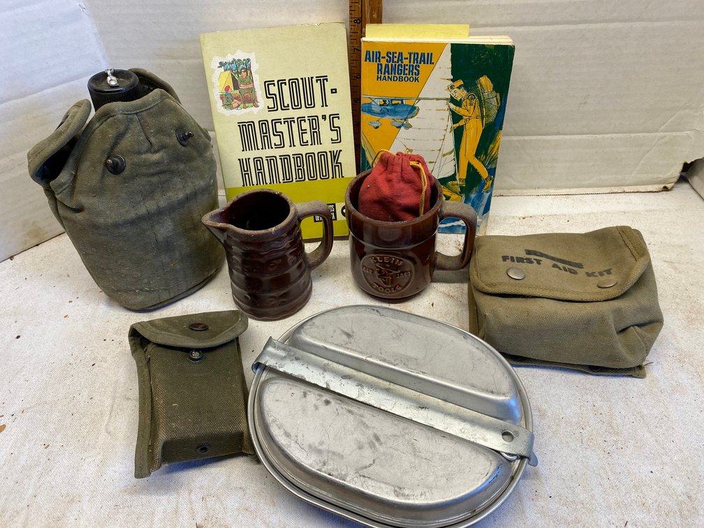 Military canteen, mess kit, Scout Master handbook from 1972, Air, Sea, Trail Ranger handbook, Klein tools mug, hand warmer
