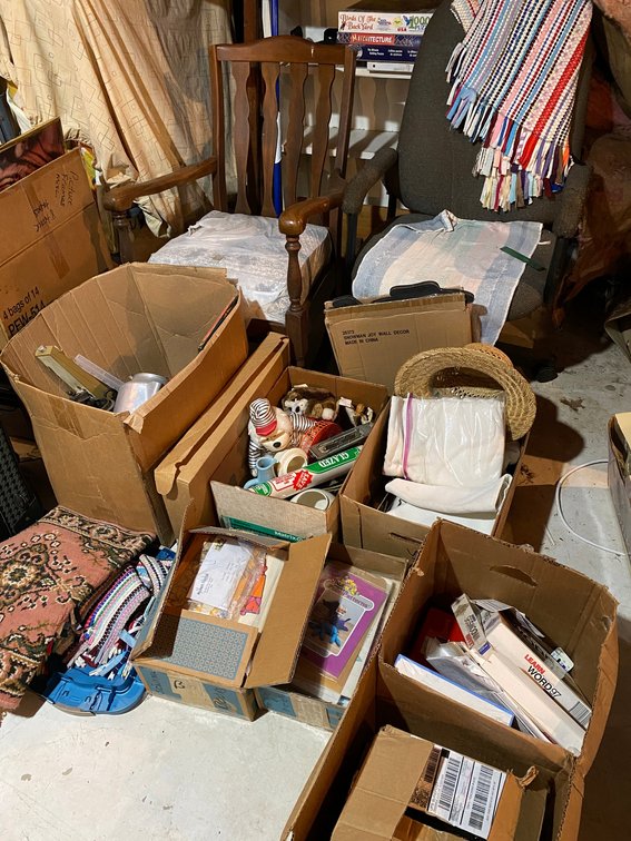 Rocking chair, office chair, boxes of household items, suitcase and more