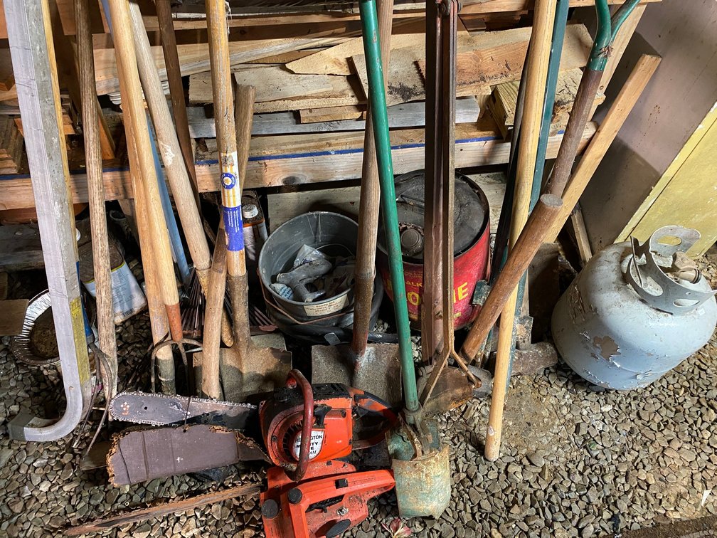 2 Remington chainsaws, hand tools, shovels, pitchforks, post diggers, propane tank