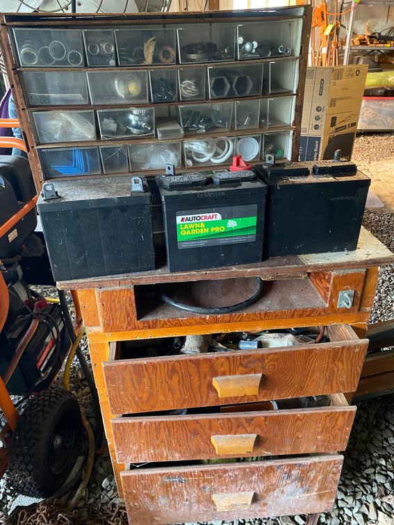 3 Lawnmower batteries**all bad**, small parts bin with assorted hardware, wooden cabinet with misc. hardware