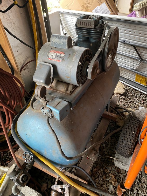 Air compressor with a Dayton 1 HP single phase 230 volt motor on a rolling cart