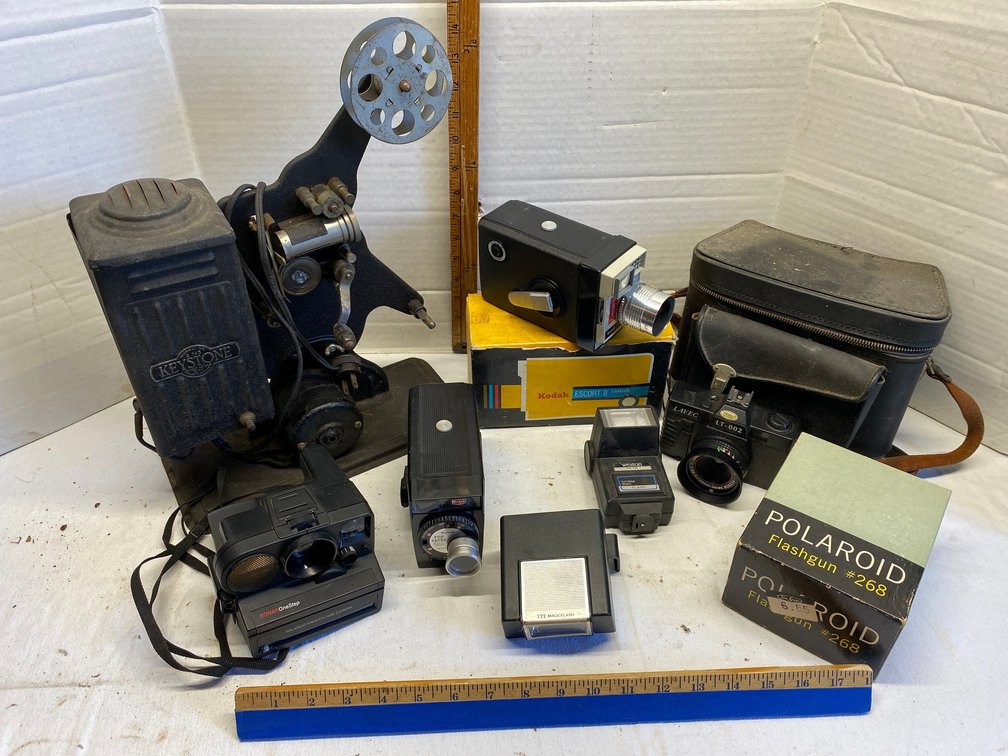 Assortment of vintage cameras-Keystone model E743, Kodak Brownie Fun Saver movie camera, Kodak Escort 8 camera, Polaroid Pronto Land camera and more