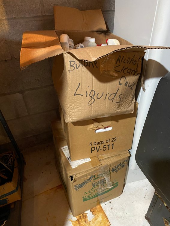 Boxes of toner, caulking, clear ammonia cleaner, other sprays