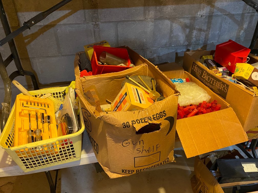 Boxes or reloading supplies, lightbulbs, screwdrivers, diagnostic tool