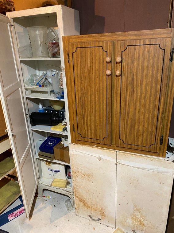 3 Cabinets-1 pressed wood wall cabinet, 1 metal wall cabinet, 1 wooden single door cabinet with contents