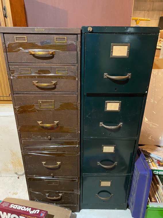 2 Metal file cabinets-1 has some camera accessories included