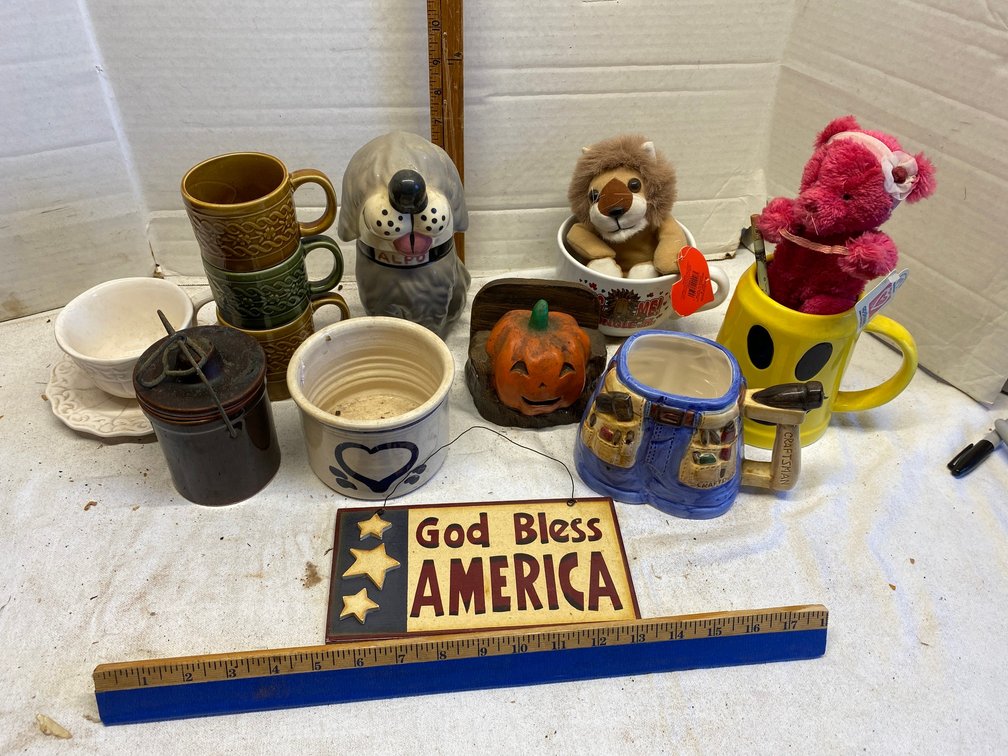 Assorted mugs, dog cookie jar, pumpkin napkin holder, other decorative items