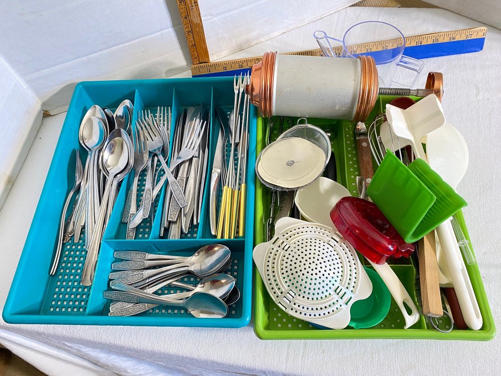 Stainless flatware, kitchen utensils, pastry press