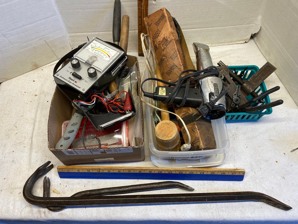 Heat gun, nail bars, filter wrenches, chalk, knives, puller