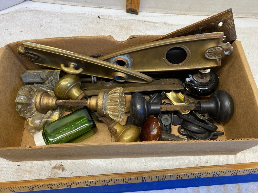 Assortment of doorknobs and hardware-some glass, some brass