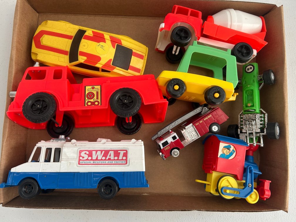 Selection of vintage plastic toy cars