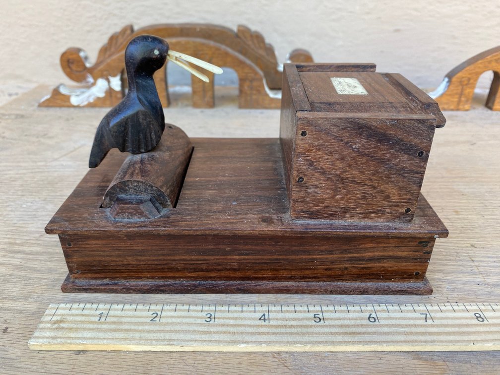 Wooden carved cigarette dispenser