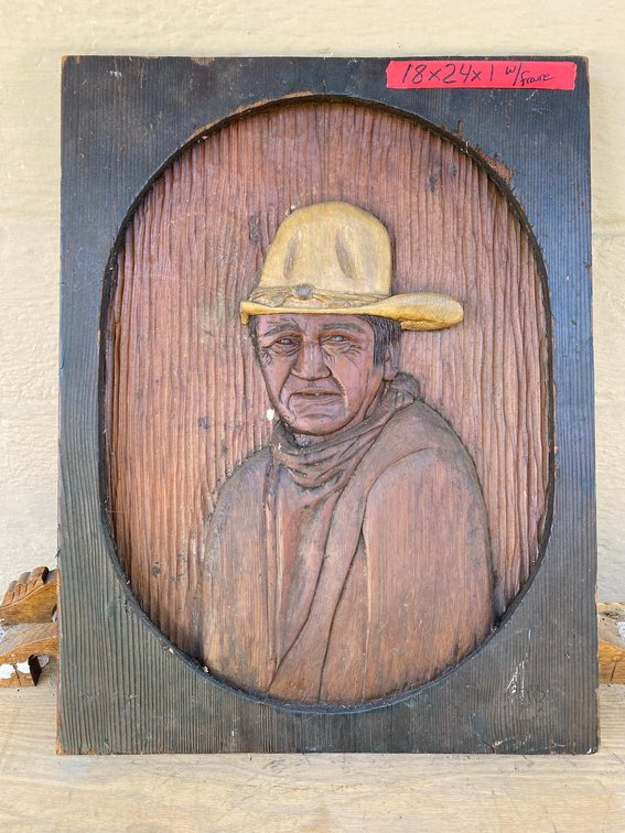Carved John Wayne wall hanging