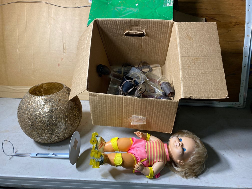 Doll baby with glass face, lamps, etc.