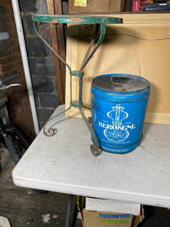 Metal plant stand, kerosene can