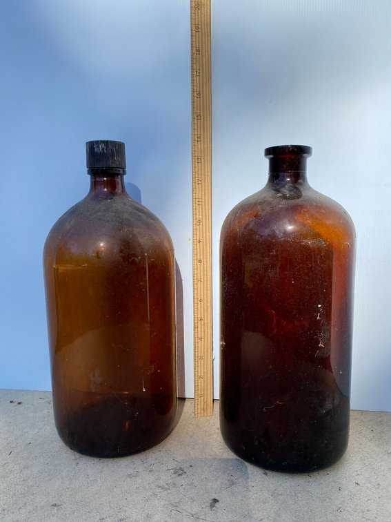 2 Large amber glass bottles