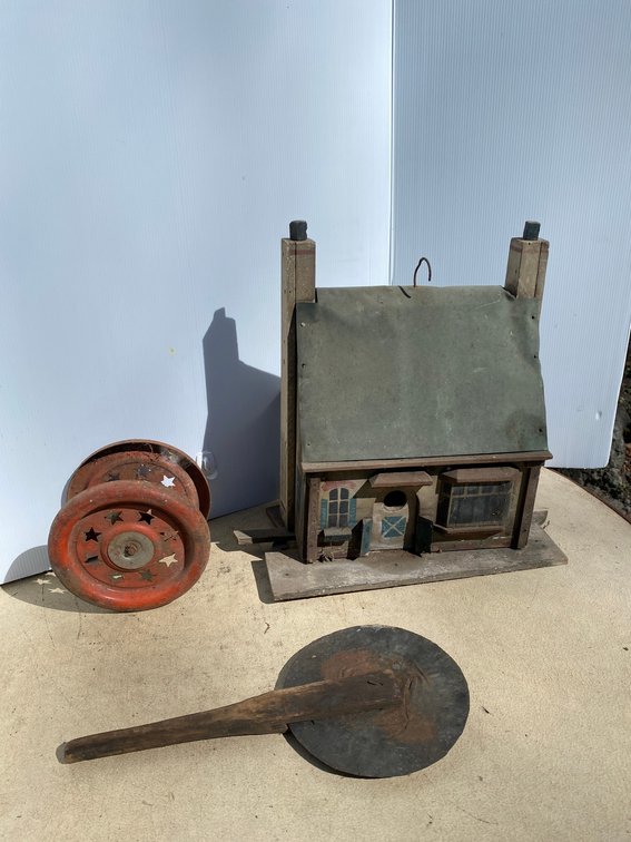 Primitive wooden birdhouse, pizza cutter, metal toy wheels