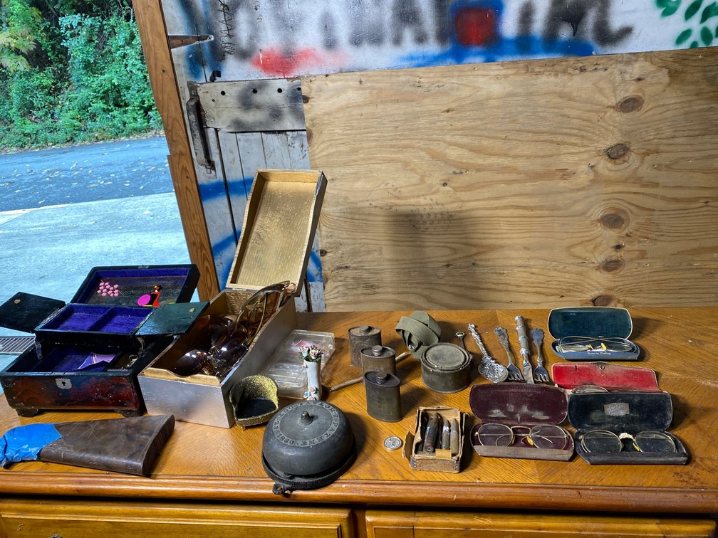Vintage doorbell, eye glasses, bullets, gun stock, jewelry box, etc.