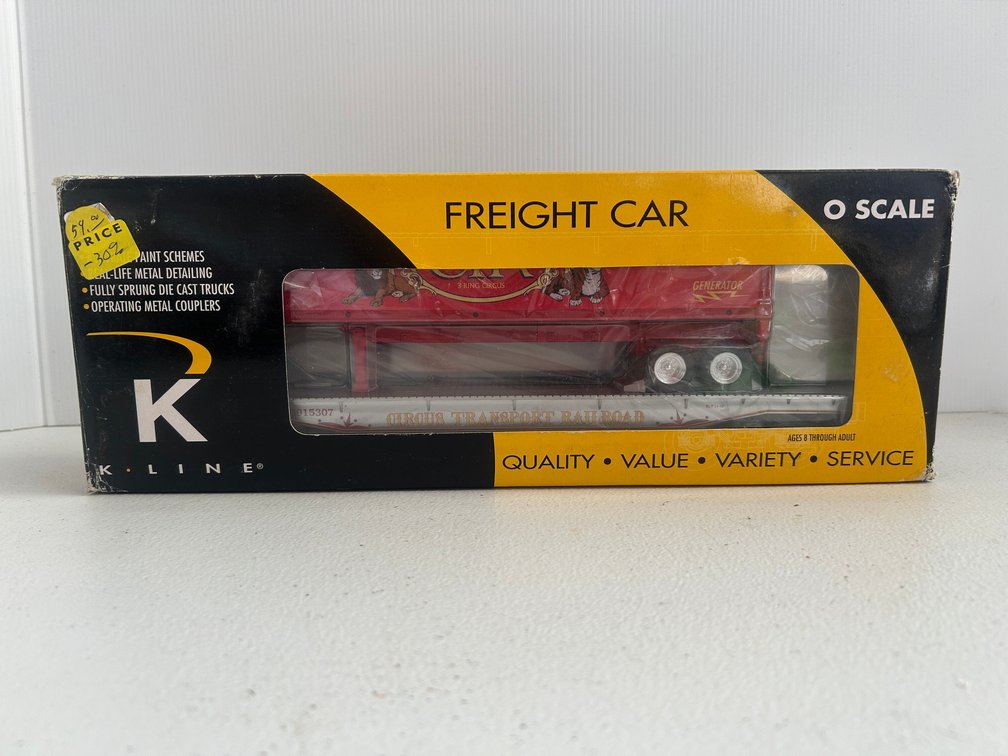 K-Line Freight car flat bed with a circus themed box trailer