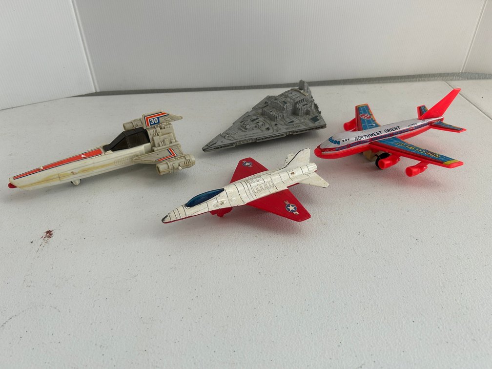 Vintage plane and spaceship toys