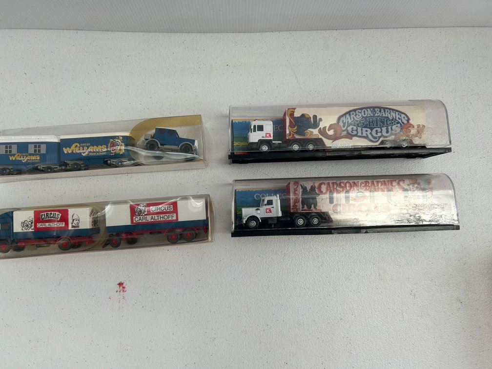 Selection of 87 scale trucks and circus wagons
