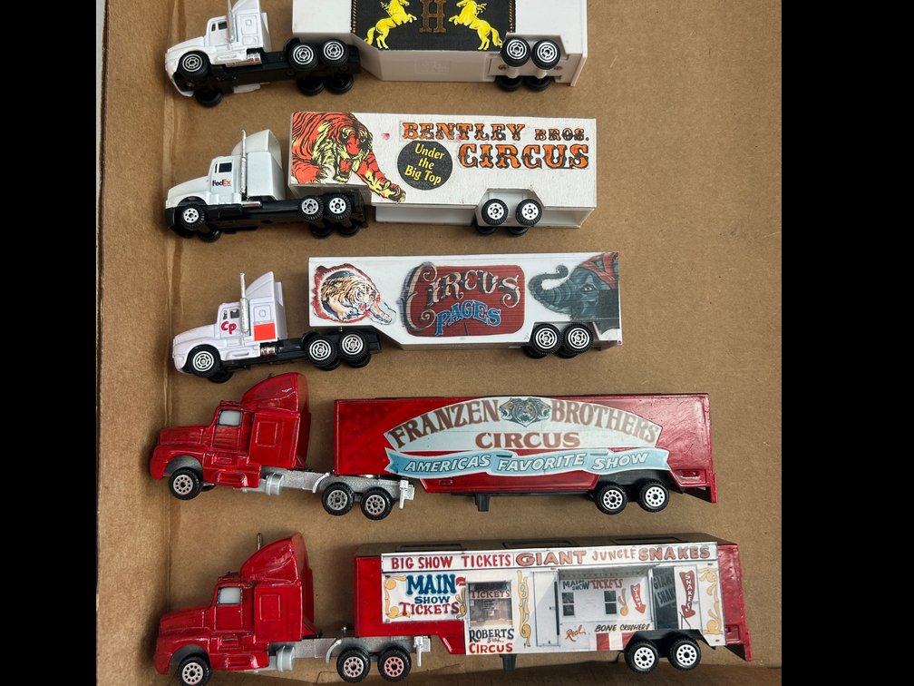 Selection of HO Scale tractor and trailer circus theme trucks