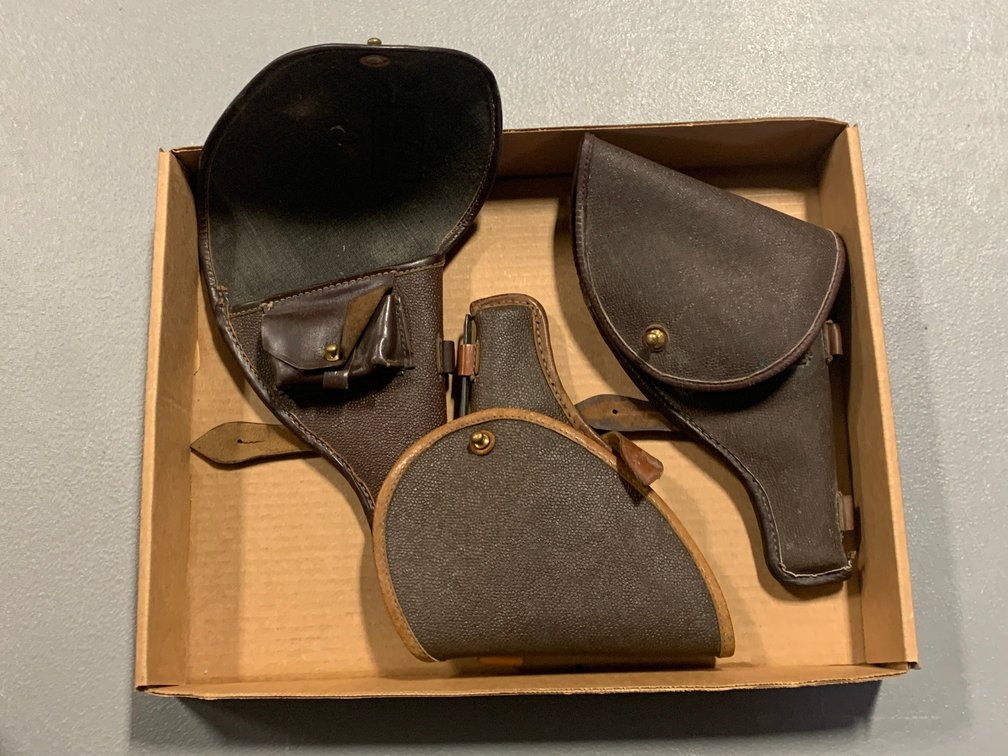 [3285]  Three Brown Leather Flap Holsters