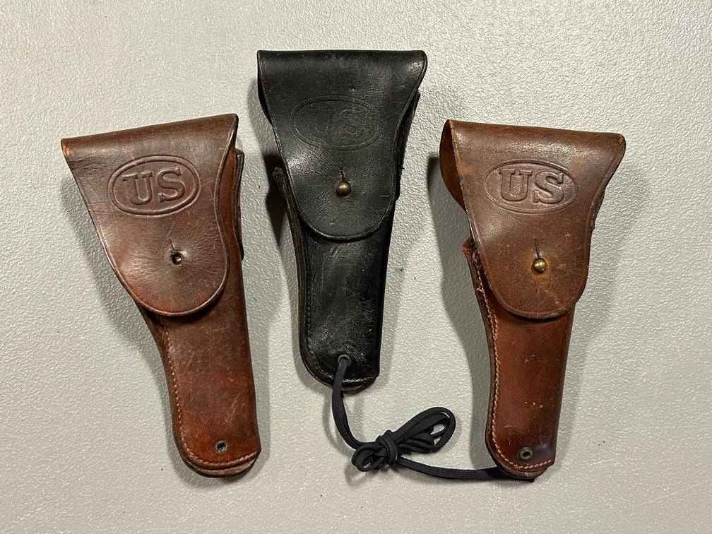 [3286]  Three Leather Flap Holsters - Embossed "US"