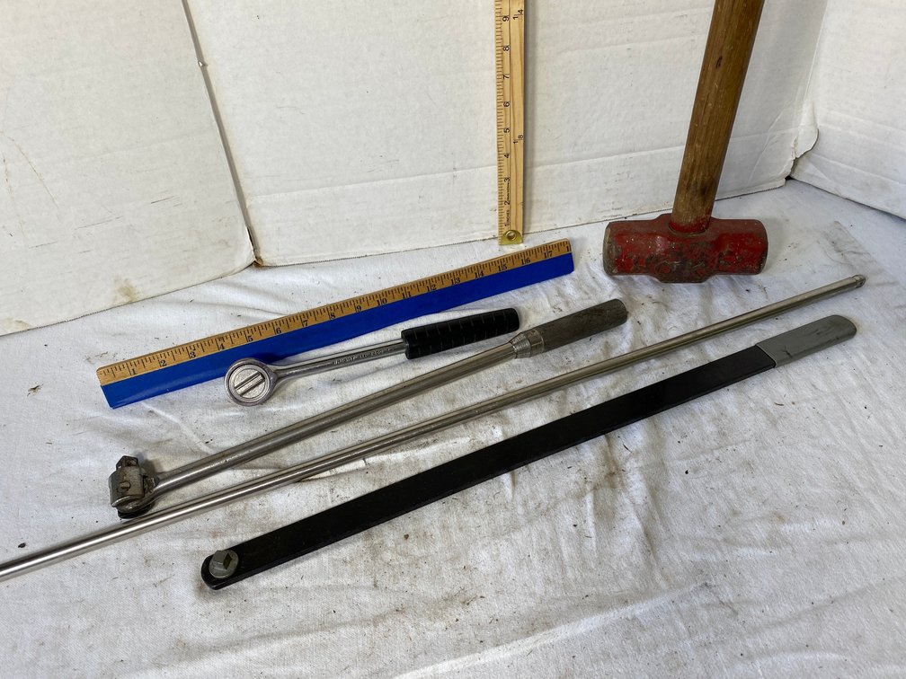 Sledge Hammer, Wright 1/2 inch Drive Rachet, Cornwell 1/2 inch Drive Breaker Bar, Snap On Very Long 3/8 Extension