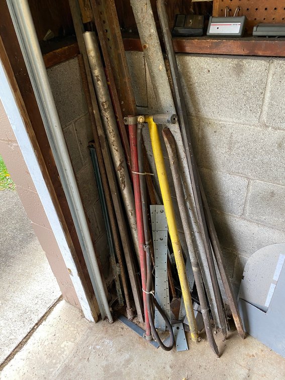 Corner Lot with Pry Bars, Scrap Metal, Pipe