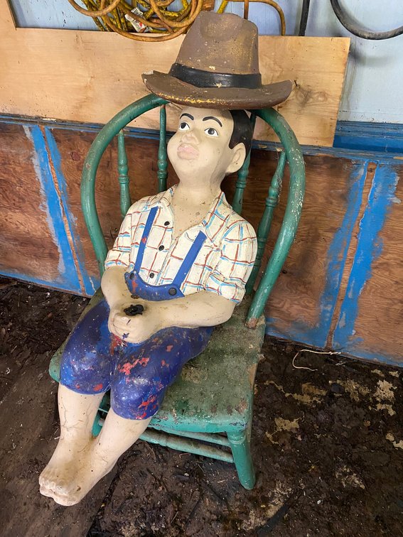 Concrete Boy in sitting position with a Hat