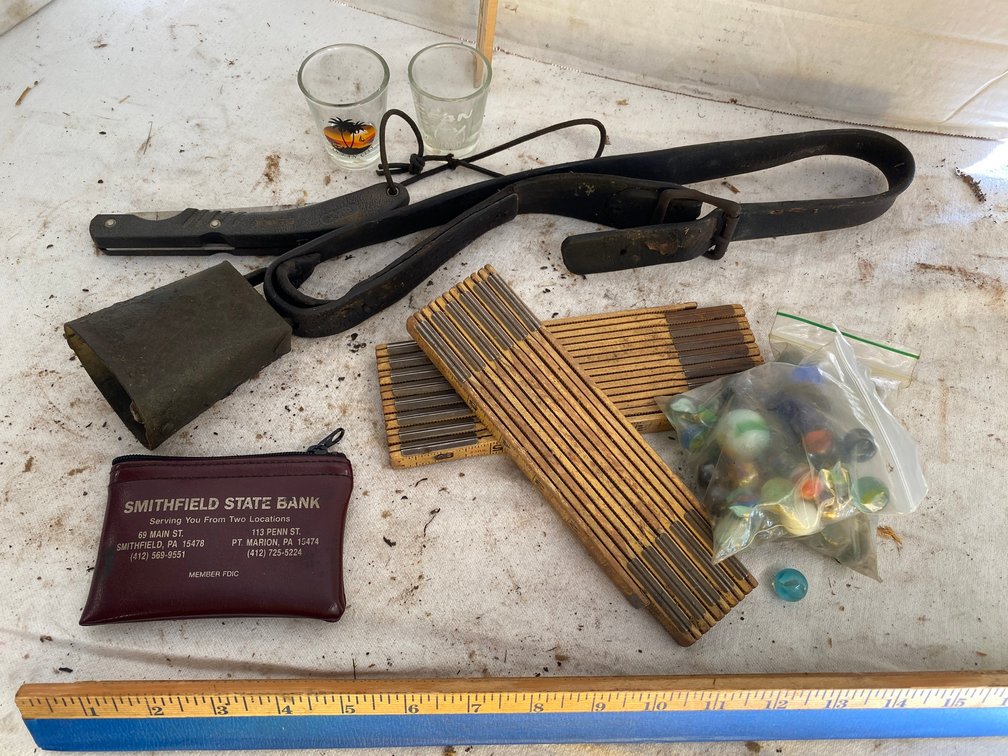 Cow Bell, Buck Knife, Assortment of Marbles, Wooden Rulers, Shot Glasses