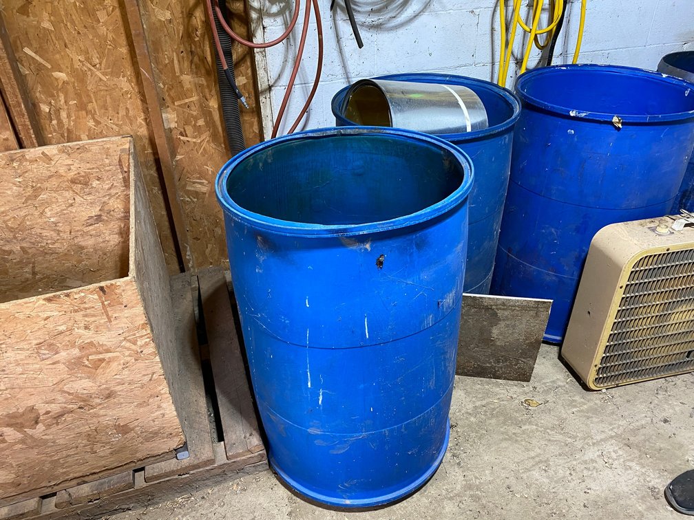 4-Plastic Drums with Tops cut Out, Box Fan, Wooden crate