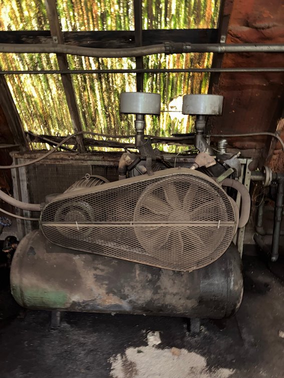 Stationary Air Compressor Mounted on a Horizonal Tank